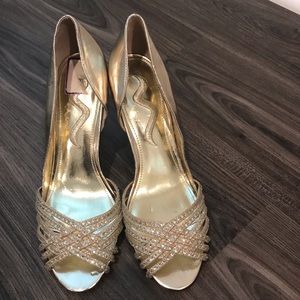 Ladies golden shoes by Nina